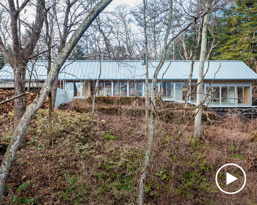 takahiro endo architects office crafts a double gable roof for forest villa in japan