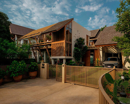 cedar shingle roof crowns tropical residence with green courtyard in thailand