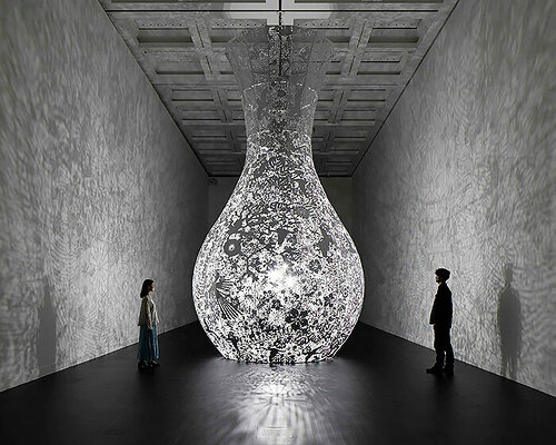 shinji ohmaki's delicately carved vessels cast shadows of flowers at national art center, tokyo