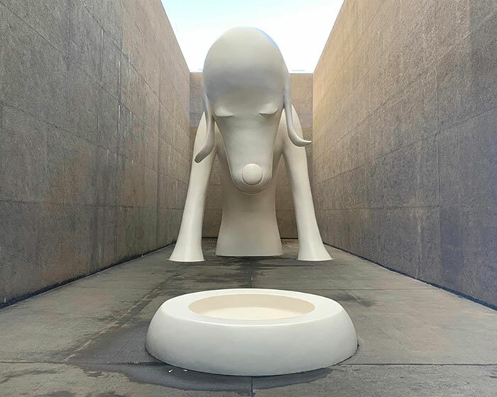 colossal dog sculpture welcomes visitors to yoshimoto nara's solo exhibition in aomori, japan