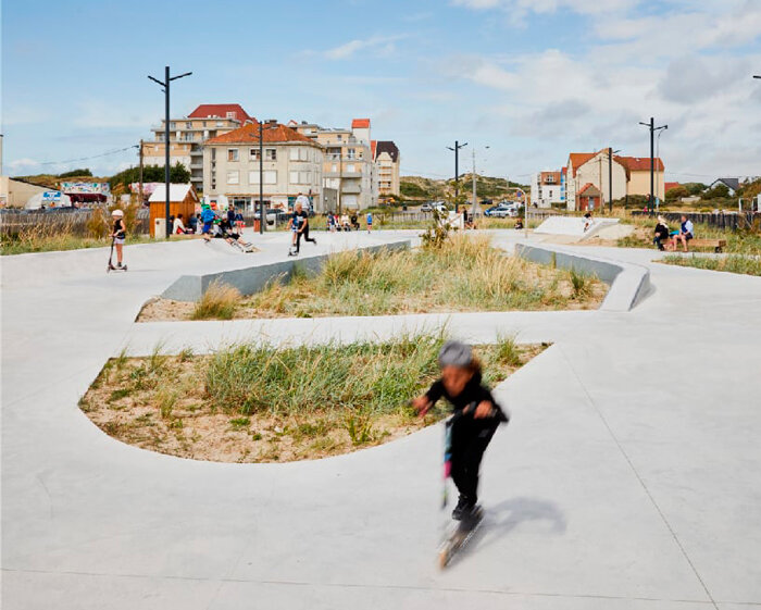 skate park's concrete curves weave seamlessly into stella plage's urban landscape in france