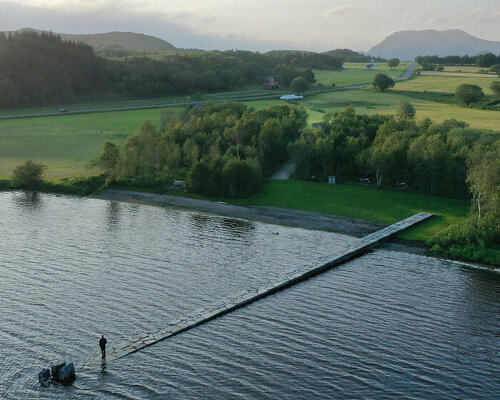 rever & drage extends stone and timber jetty from norwegian forest across the bay 