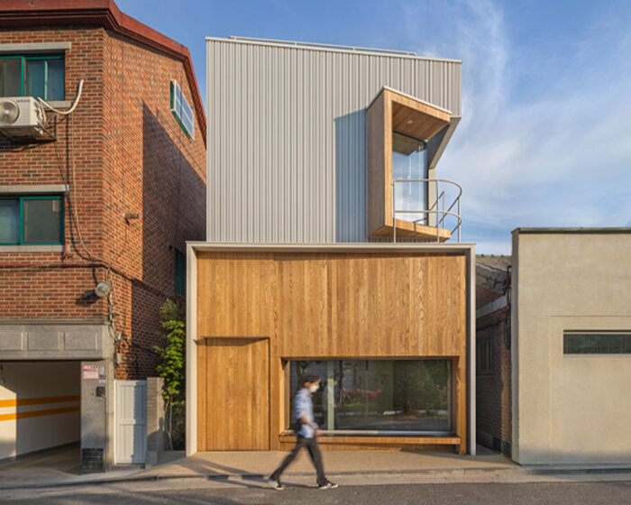 younghan chung's tiny forest house in korea unfolds as a freeform wood and steel volume