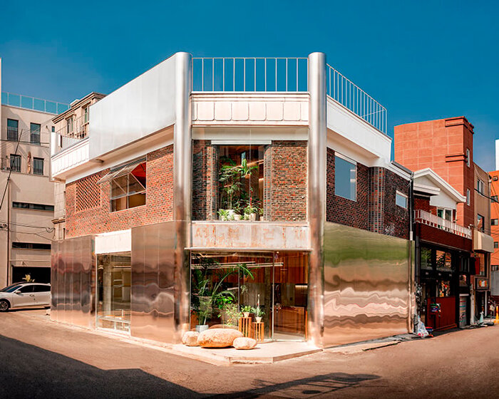 brick, concrete and stainless steel compose layered facade of renovated café in korea