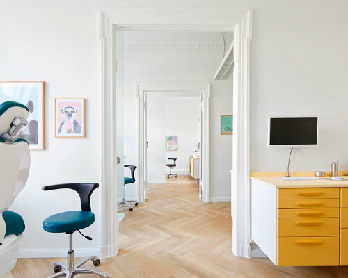 bespoke furniture pieces made of steel and wood adorn redesigned berlin dental practice