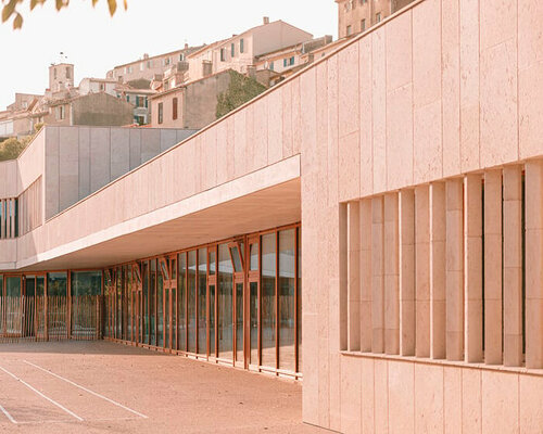 amelia tavella embeds tiered educational institution within valley's natural contours in france