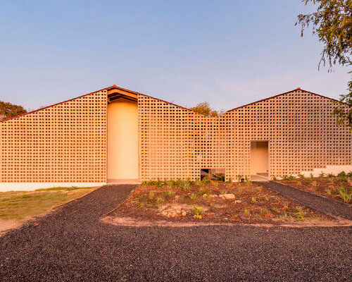 salt architects sets up concrete-block screen to expand educational facility in south africa