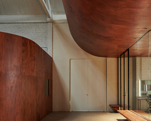 delordinaire imbues redwood curves & raw earth bricks into rouchon paris production studio