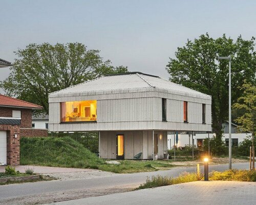 wirth architekten balances neo-palladian dwelling on core concrete podium in germany