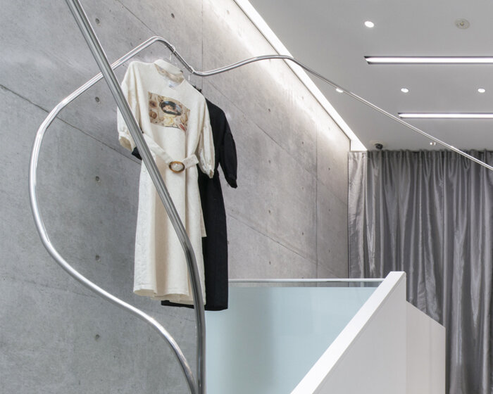 stainless steel tubes curve and flow across the mikage shin aoyama store in tokyo