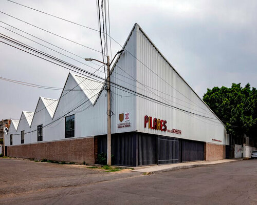 metallic roof shapes triangular folds atop a|911's cultural infrastructure in mexico city