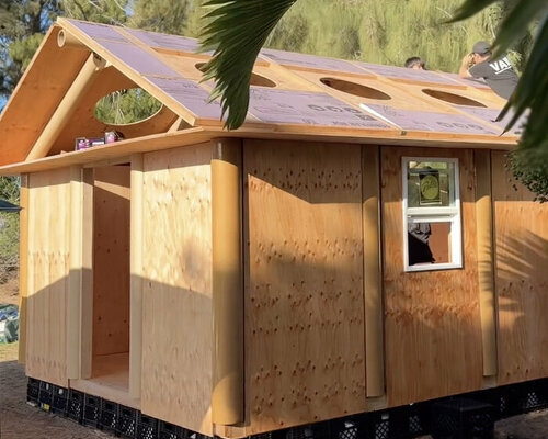 shigeru ban's paper log house prototype lands in maui for wildfire relief