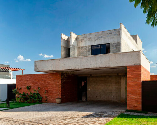 red brick and concrete stacked blocks shape vão house in brazil