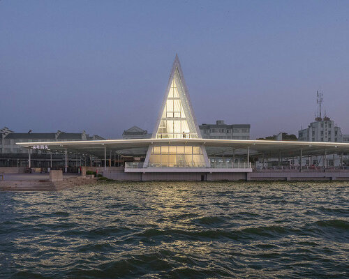 UAO design's liangzi island pier is punctuated by a glowing A-frame 'lighthouse'