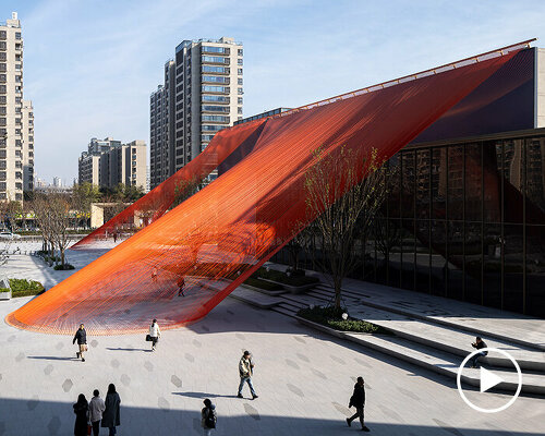 behin ha weaves temporary installation with orange fabric ribbons at hangzhou complex