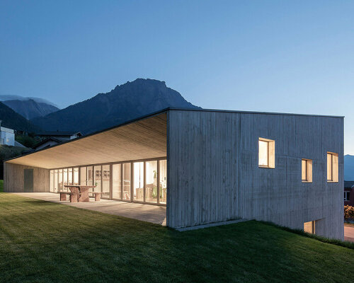 comamala ismail inserts two-level concrete nursery on steep slope in switzerland