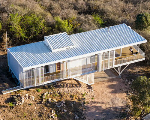 zayat arquitectura encases 'house in the clouds' with perforated panels in argentina