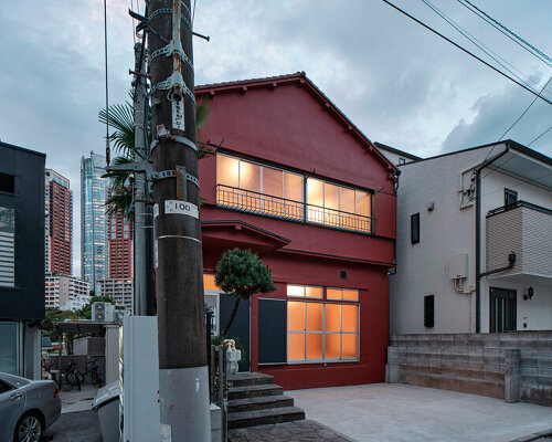 renovated wooden house boasts bright red facade in central tokyo