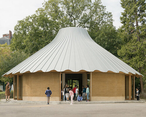 l'atelier senzu builds carousel-inspired rammed earth pavilion for parisian school