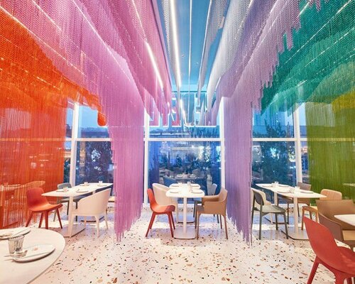 dine under a rippling rainbow at SODA architects restaurant in beijing