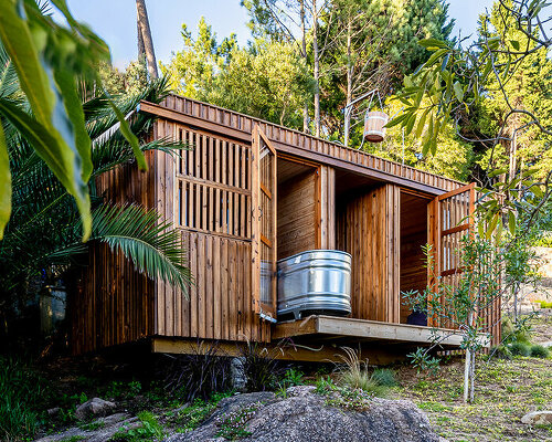 madeiguincho's wooden sauna frames panoramic views of the lush portuguese landscape