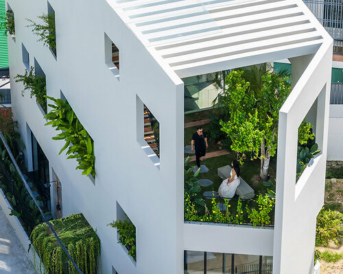 cut-out patios bring nature inside pham huu son's skygarden house in vietnam