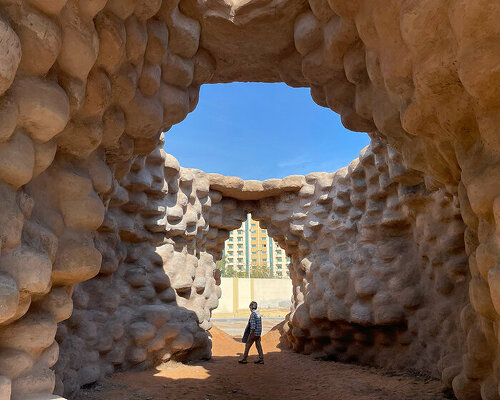 wallmakers uses 1,425 discarded tires coated in desert sand for sharjah triennial pavilion 