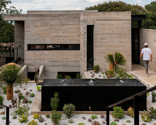 four intertwined levels extend ayg house's living zones towards greenery in mexico city