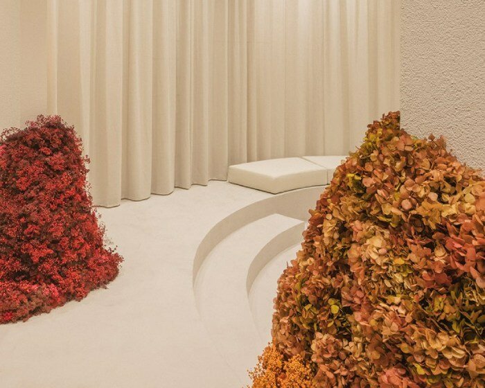 clap studio and amiguis' floral installation at valencia showroom welcomes spring