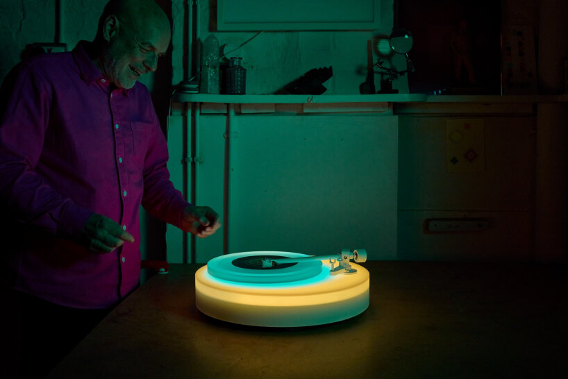 brian eno's turntable II glows in different acrylic neon lights as 