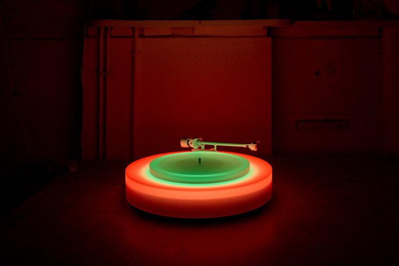 brian eno’s turntable II glows in different acrylic neon lights as the ...