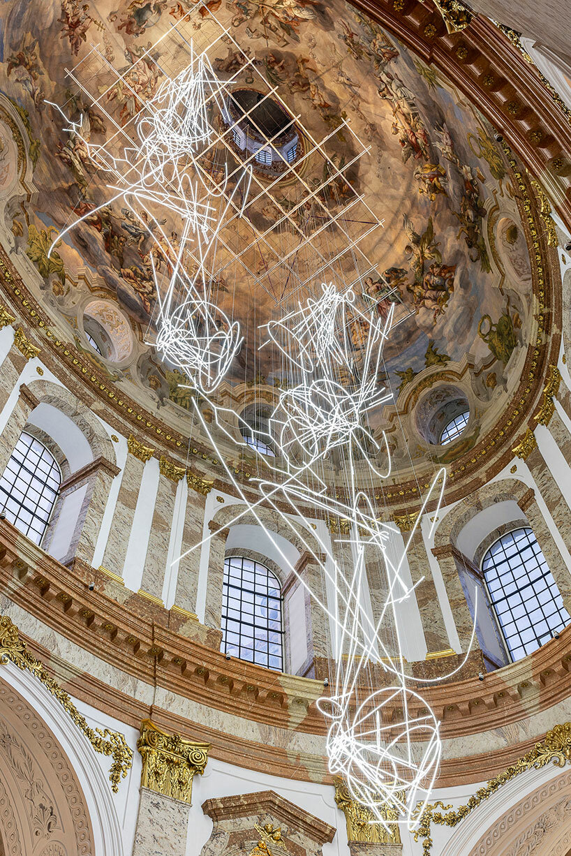 cerith wyn evans suspends neon squiggle installation within 