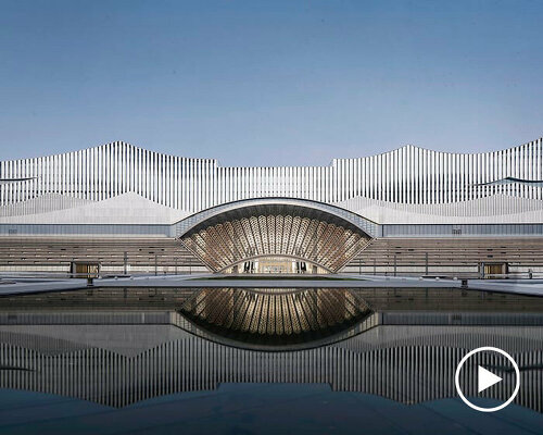 changsha conference center's facade employs perforated metal panels for a river-like effect