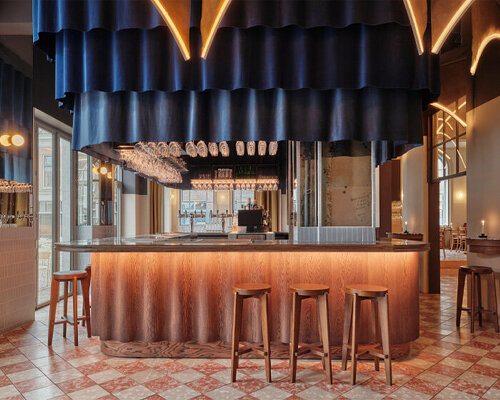 studio modijefsky revives dilapidated cinema as all-day brasserie in the netherlands