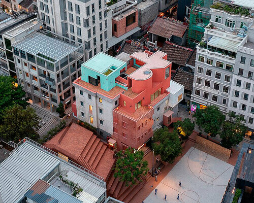 colorful geometric volumes by URBANUS extend atop old building in china