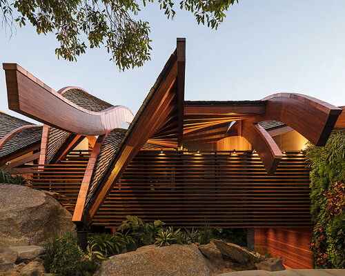 the wave house resembles a vessel sailing through rio de janeiro's waters