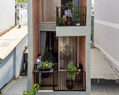 story architecture fronts this narrow house in vietnam with stacked terraces