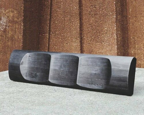 ákos huber carves reclaimed wood into monolithic bench reminiscent of native totem poles