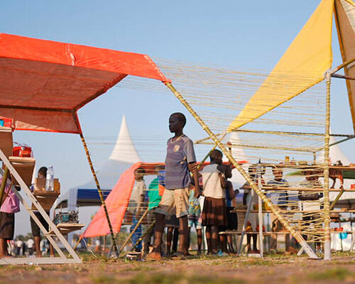 colorful angular tents shape puzzle-like zanya pavilion in northern uganda