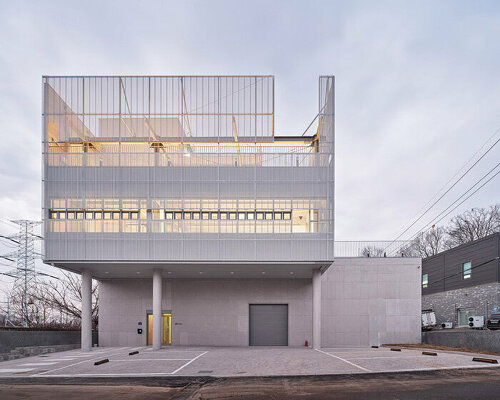 perforated metallic shell extends c-project's exposed concrete base in south korea