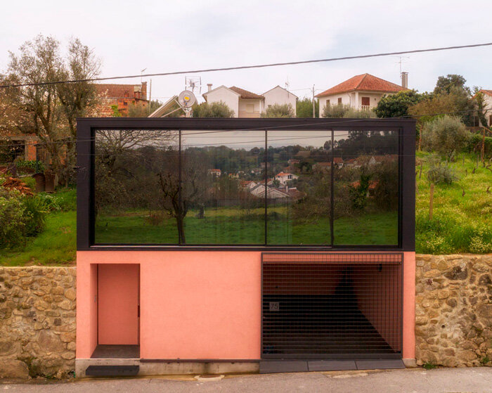 casa da póvoa by waataa opens up towards the landscape of nandufe in portugal