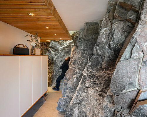 minimalist architecture meets raw stone: a house in argentina is built into the earth