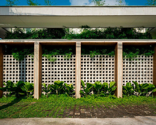 concrete block screen welcomes sunlight and gentle breeze in platform 21's manila residence