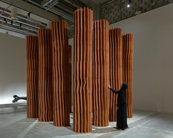 sahel alhiyari's fluted terracotta columns at design doha are an ode to classical antiquity