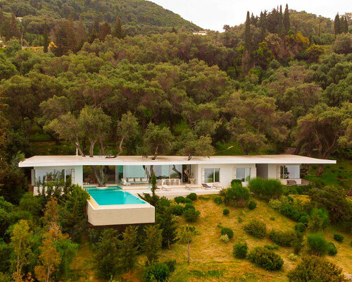 cantilever parabolic timber canopy tops holiday house h enclosed by corfu's rock formations