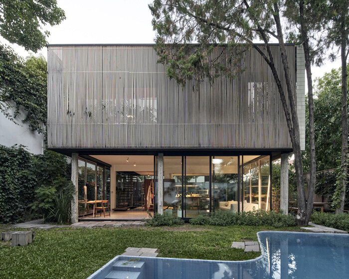 la base studio designs 'casa mendoza' as a glass box in a private garden