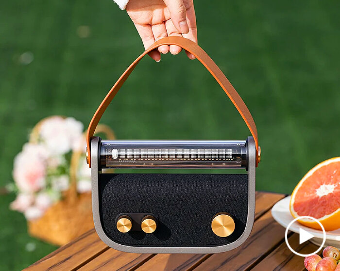 LUNA audio is a bluetooth radio with fluorescent display that can be carried like a handbag