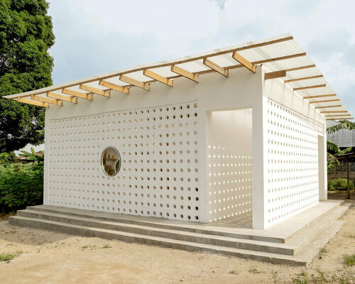 perforated mud brick exterior shields mariam's library by parallel studio in tanzania