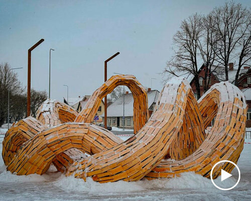 wooden shingles compose uv lab's undulating snake-like public installation in estonia