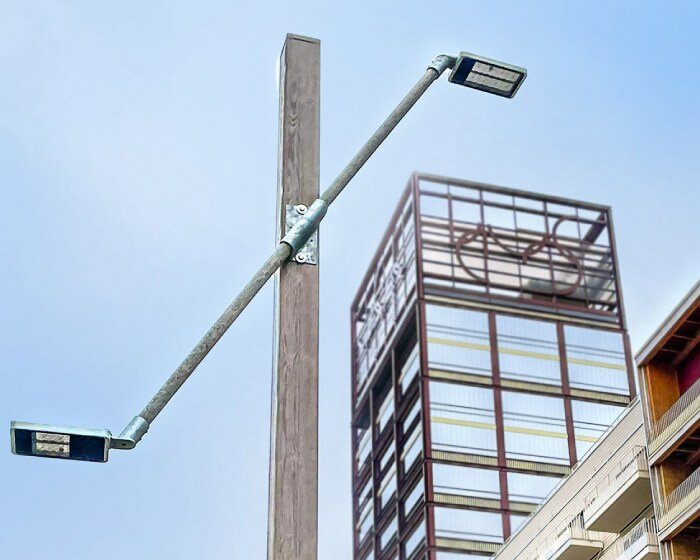 studio 5•5 repurposes scaffolding pipes and street lamps to illuminate paris olympic village